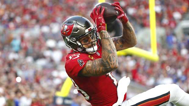 Dec 12, 2021; Tampa, Florida, USA; Tampa Bay Buccaneers wide receiver Mike Evans (13) catches the ball for a touchdown against the Buffalo Bills during the first half at Raymond James Stadium. Mandatory Credit: Kim Klement-USA TODAY Sports
